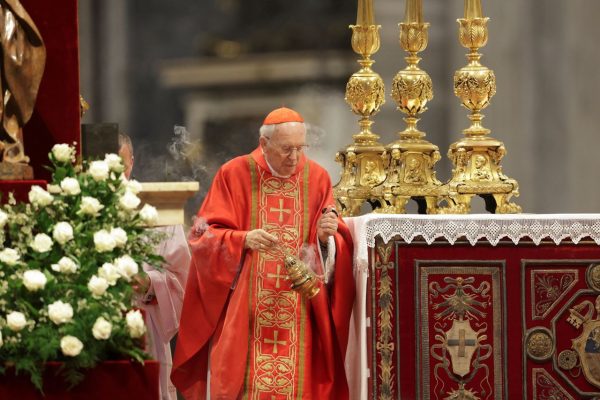 Priests begin distributing Holy Communion
